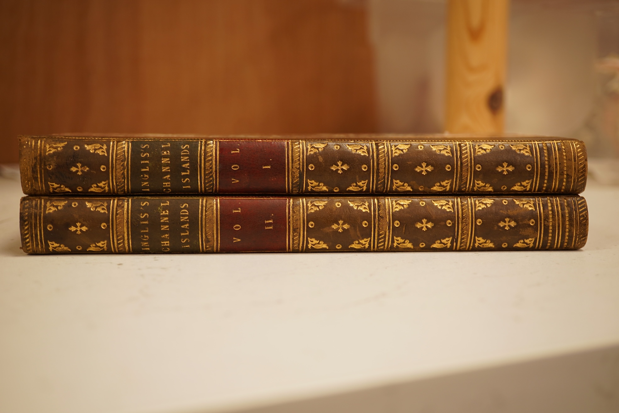 Inglis, Henry D. - The Channel Islands ... [the result of two year's residence]. 2 vols. 2 maps; old half calf and marbled boards, gilt decorated and panelled spines, sm.8vo. 1834